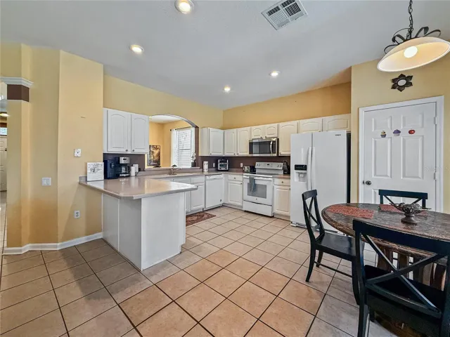 Kitchen with Breakfast Bar and Dining