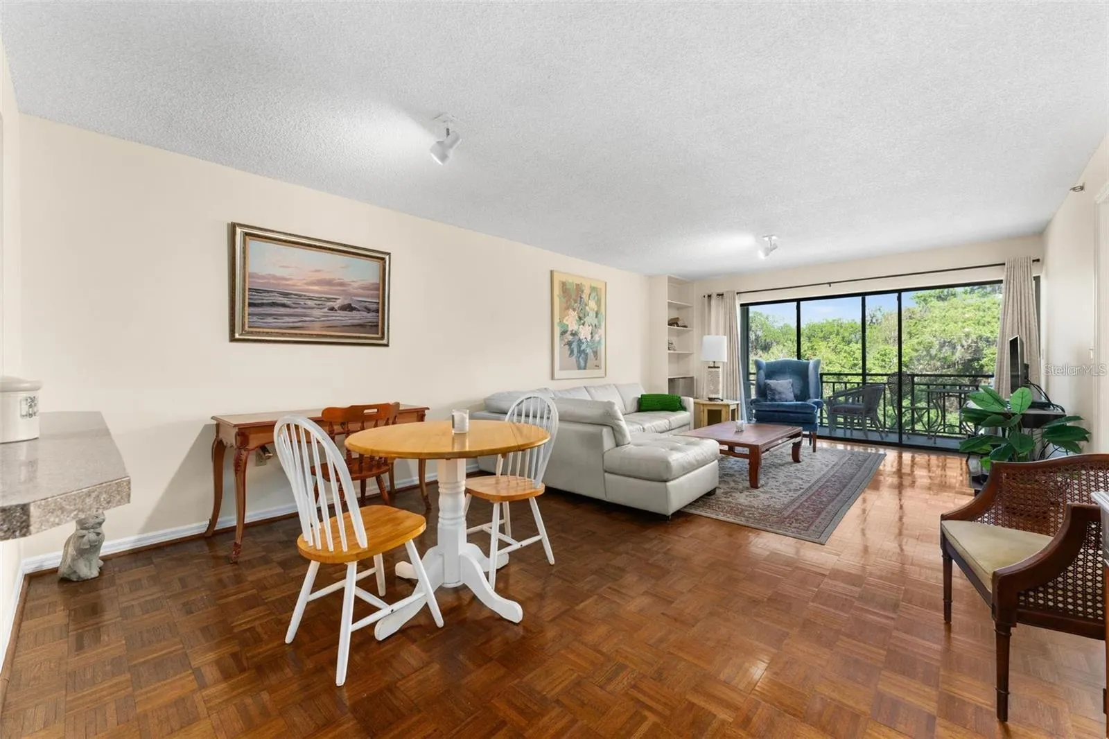 Dining Area and Breakfast Bar to Kitchen