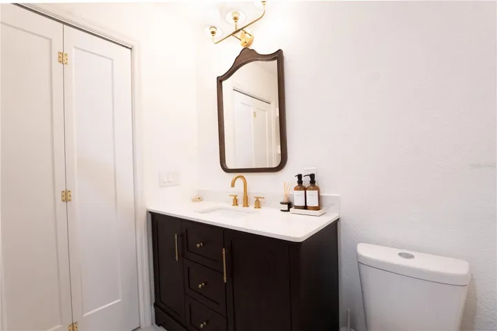 Gorgeous updated primary bathroom with wooden bathroom vanity