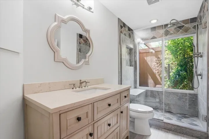 Full Guest Bathroom with newly replaced glass