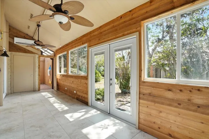Back Florida room with split unit AC, Fans and french doors leading to the side yard