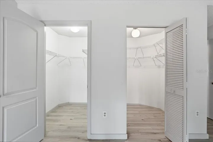 two walk in closets in primary bedroom