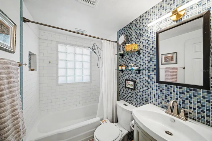 Bathroom with Beautiful Tiled Wall
