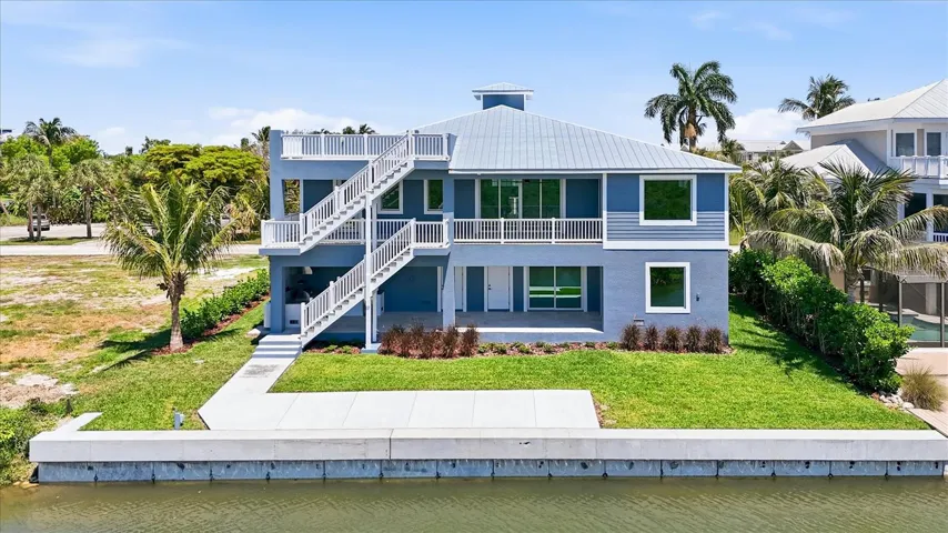 REAR LANAIS AND 13,000LB BOAT LIFT!
