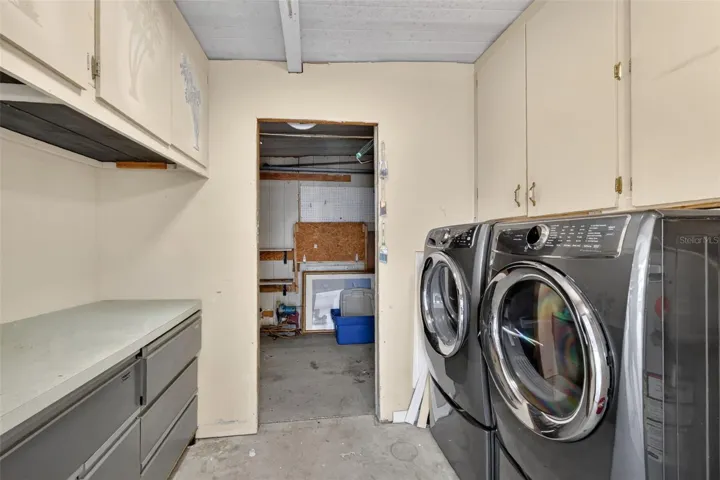 Newer Electrolux washer and dryer-connected to golf cart garage
