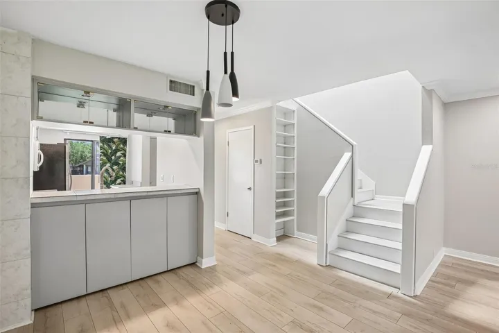 DINING ROOM WITH STAIRS LEADING TO ALL BEDROOM SUITES UPSTAIRS