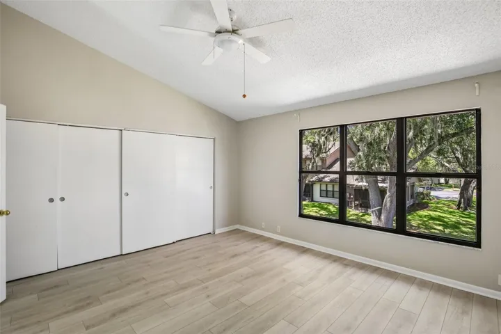 PRIMARY BEDROOM OVERLOOKS BACK YARD