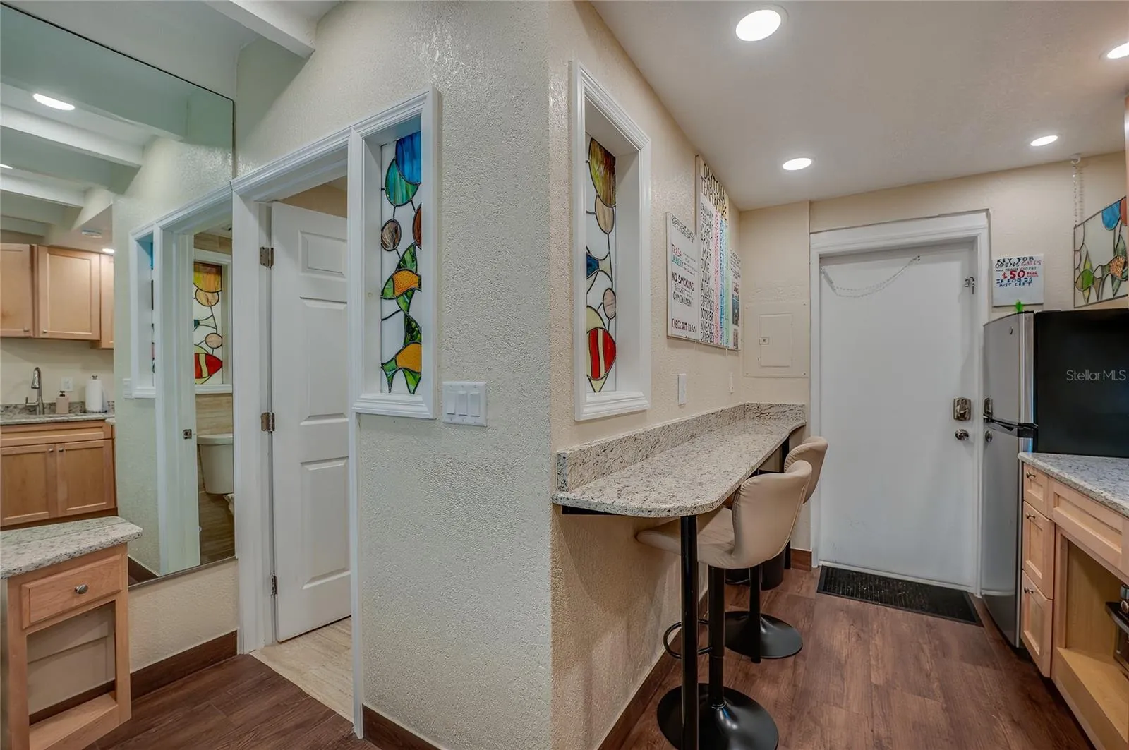 A convenient built-in bar area with seating offering a space-saving dining solution that's perfect for a quick breakfast or a casual meal.