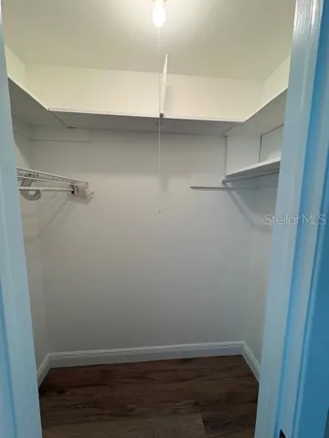 Step in closet in the second bedroom.