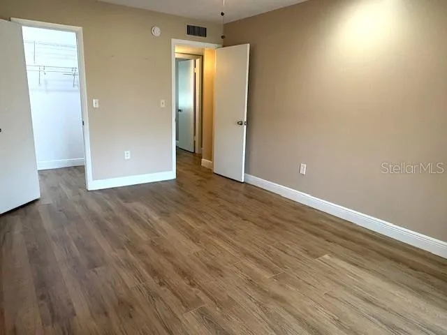 Primary bedroom with walk in closet.