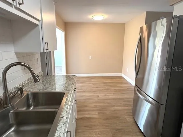 From the kitchen, facing the dining area.