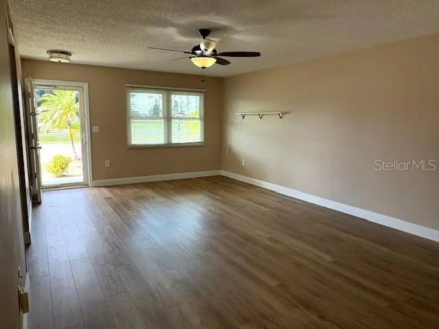 Living room, facing the front entry.  Glass door gives you the option for more natural light.