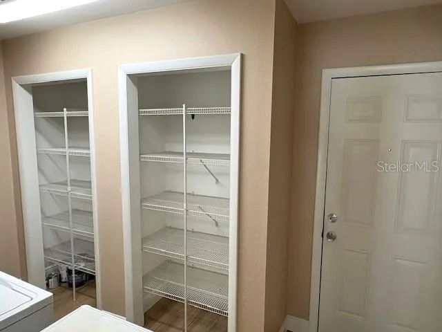 Easy access from the kitchen to this spacious pantry.  Door leads to garage, making coming and going easy.
