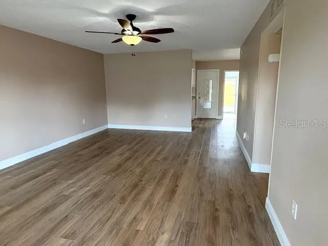 Front entry.  Living room features beautiful natural light.  Updated luxury vinyl flooring throughout the home.