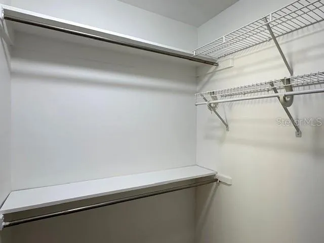 Primary walk in closet.