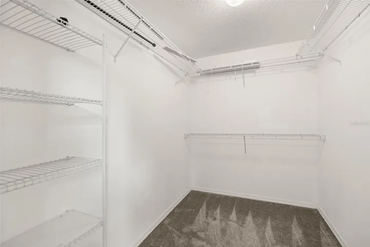 Large walk-in closet primary bedroom