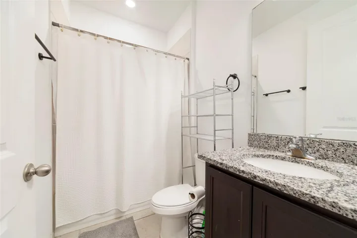 Three additional generously sized bedrooms and another full bath offer flexibility for guests, a home office, fitness space, or growing households.