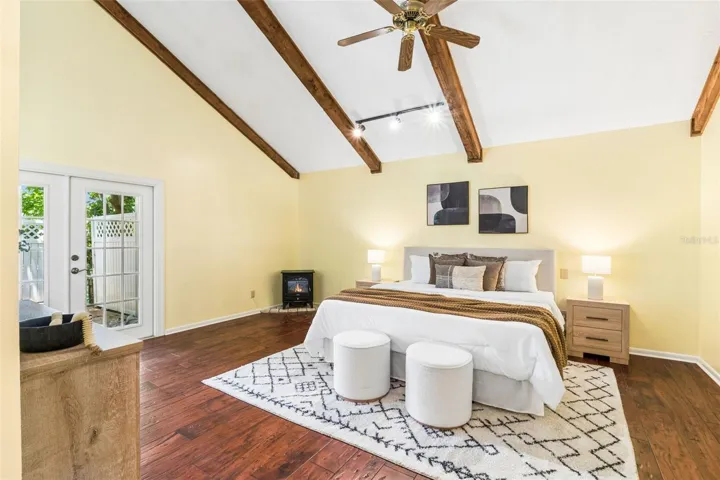 Primary room with french doors leading to private deck