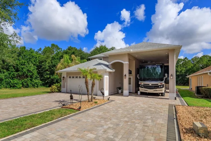 RV Port home - this port is 45' long to easily accommodate your RV with full hook-ups!