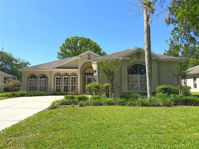 Front exterior with gutters, storm door and two car garage