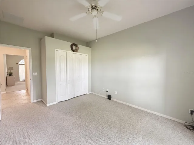 Bedroom 3 with golf course view, built in closet, decorative shelf
