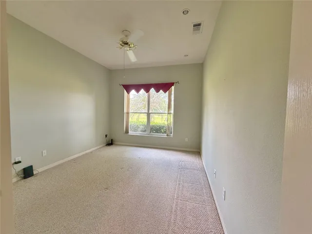 Additional view of Bedroom 3 with golf course view, built in closet, decorative shelf