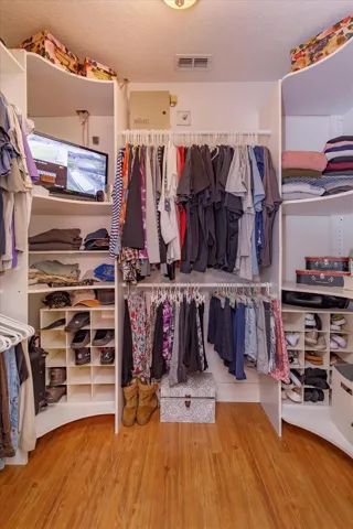 Large walk-in Closet, so organized!!  Security system stays!