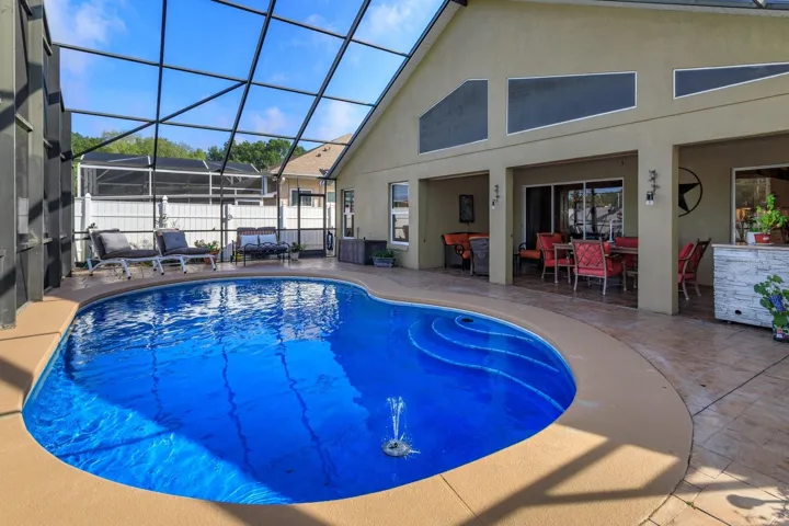 Pool area with surrounding decking and fencing!