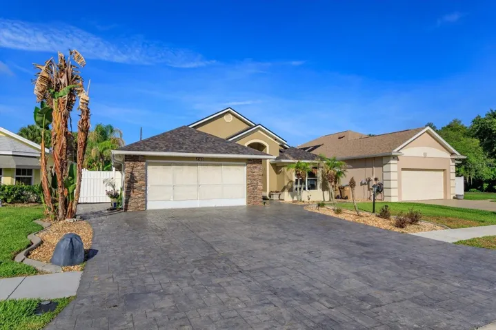 Extra wide driveway offers ample parking for guests.