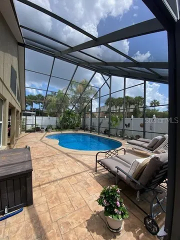 Vaulted lanai screening, covered and uncovered lounging areas, private fencing all around the rear of the property.