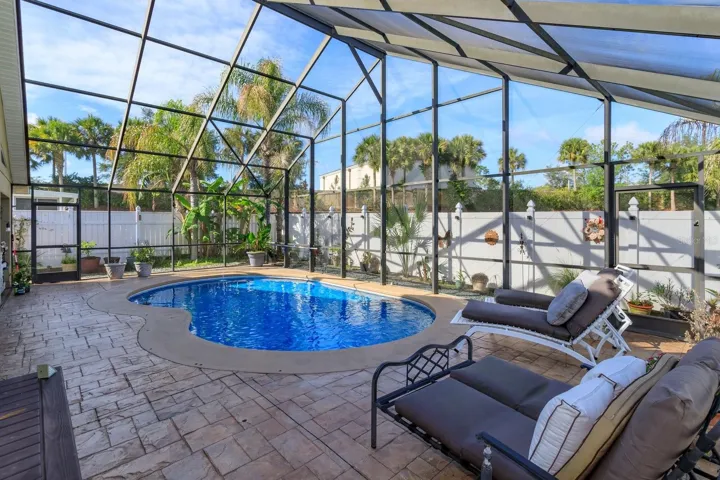 Pool deck has plenty of lounging area.  Note inside the surrounding fenced area is nicely landscaped.