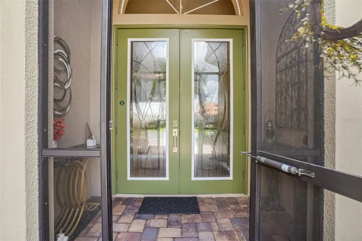STUNNING Double Leaded Glass Door & Screened-In Front Lanai