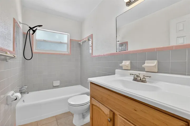 Hall bathroom featuring a tub and shower combination