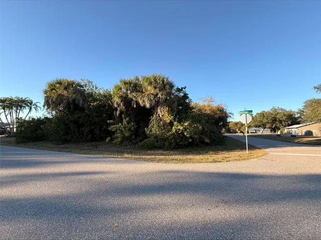 Oversized corner lot with paved road frontage