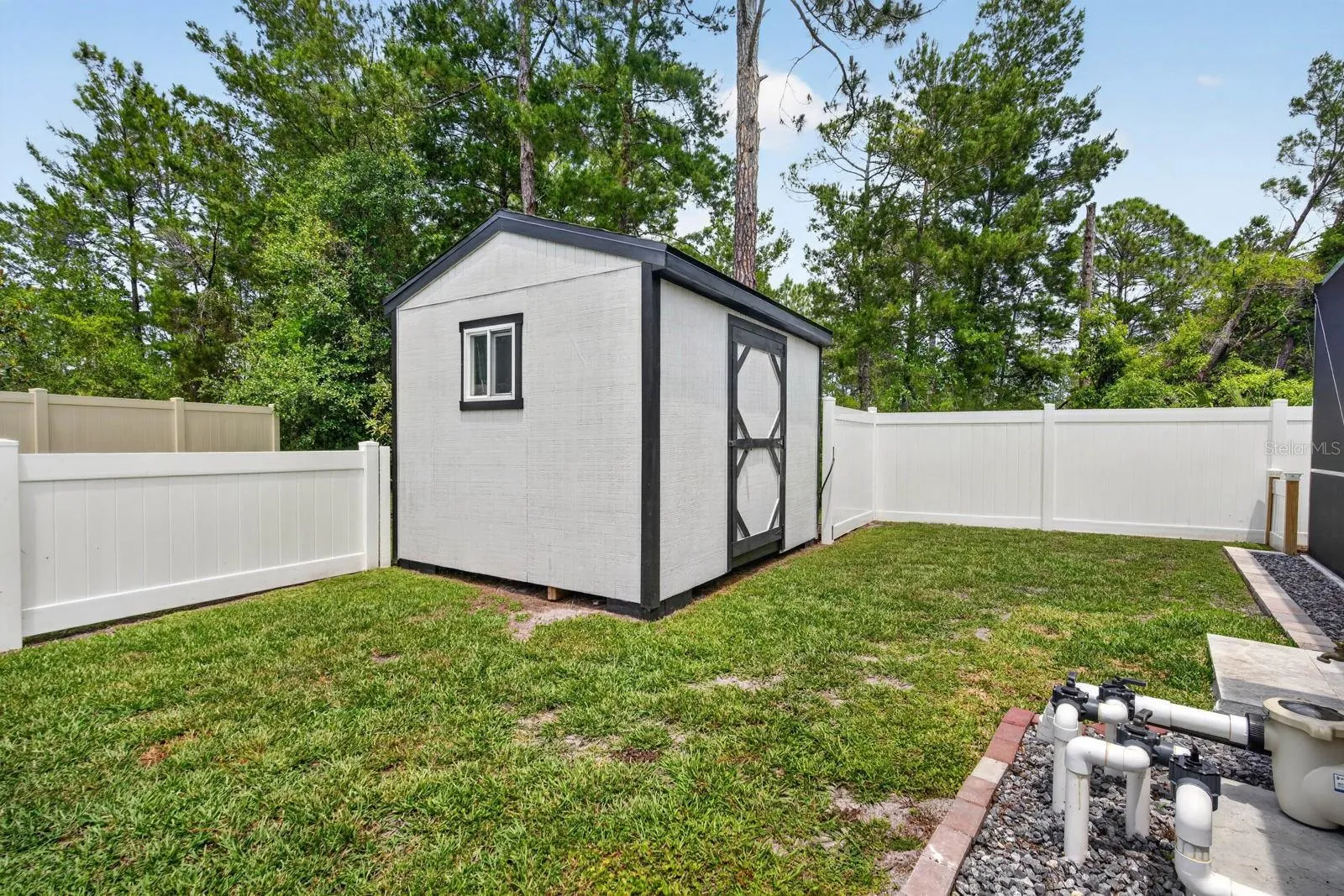 Outdoor shed for all your lawn care equipment.