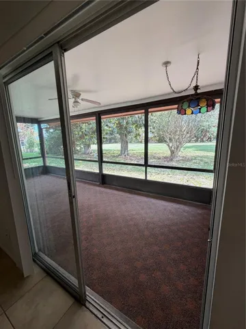Back covered screened in patio from the dinning room