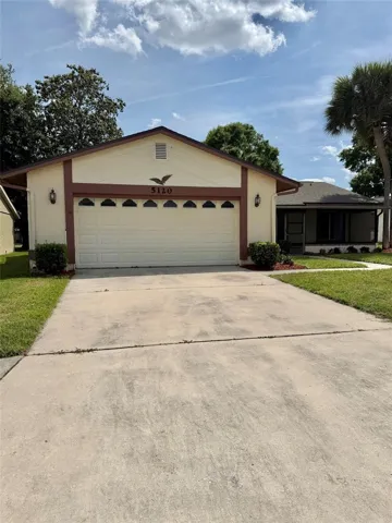 Paved driveway with large two car carage