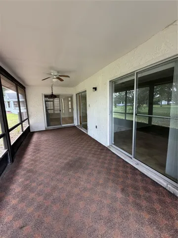 Back screened in patio with sliding glass doors to the master bedroom on the right, dinning room and family room for those beautiful Florida days