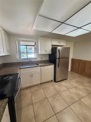 Large kitchen with access to the garage on back right