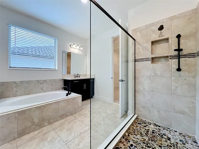 Luxurious spa-style owner’s bathroom