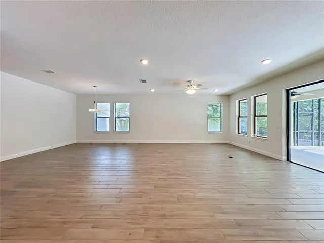 The expansive dining and great room serves as the heart of the home