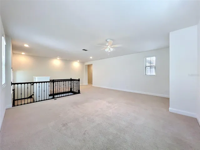 Loft offering the perfect flexible space for family gatherings, a media room, game room, or additional living area.