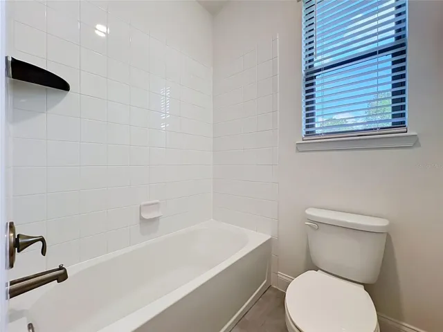 Jack-and-Jill bath appointed with a tub/shower combination