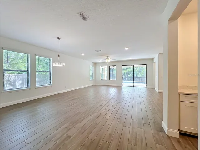 Designed with an open and airy ambiance, the home offers spacious living areas filled with natural light