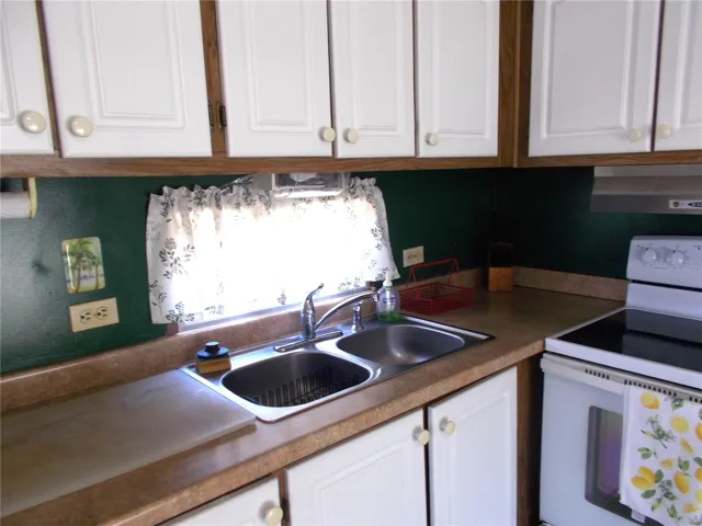 Kitchen showing double stainless sink