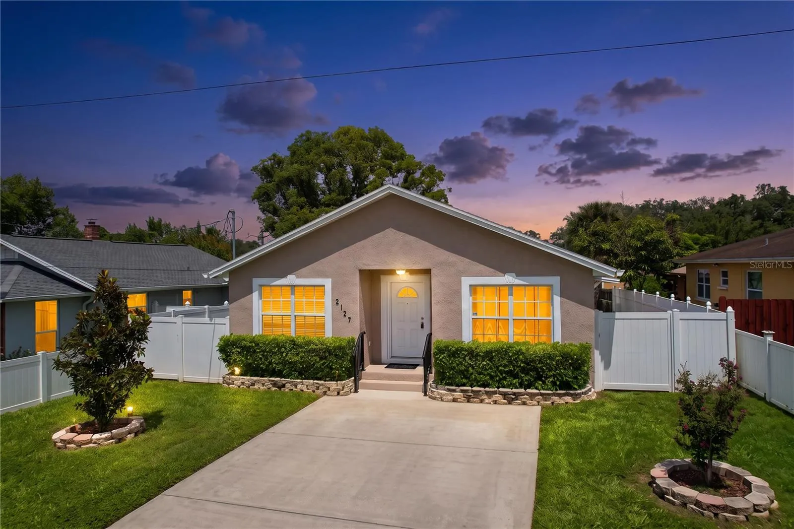 Night View of 3 Bedroom House Showing Green Lawn