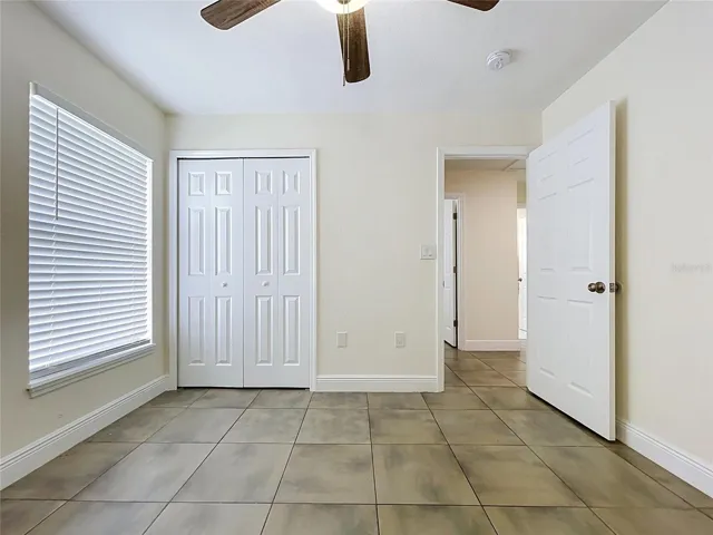 Bedroom with Ceramic Flooring, Fan and Double Size Window
