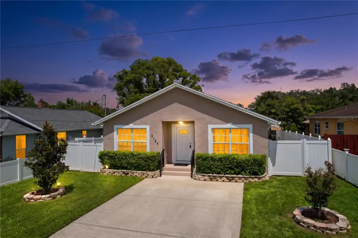 Night View of 3 Bedroom House Showing Green Lawn