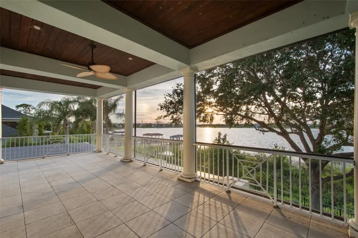 Wrap around balcony upstairs to take advantage of almost every room having a lake view!