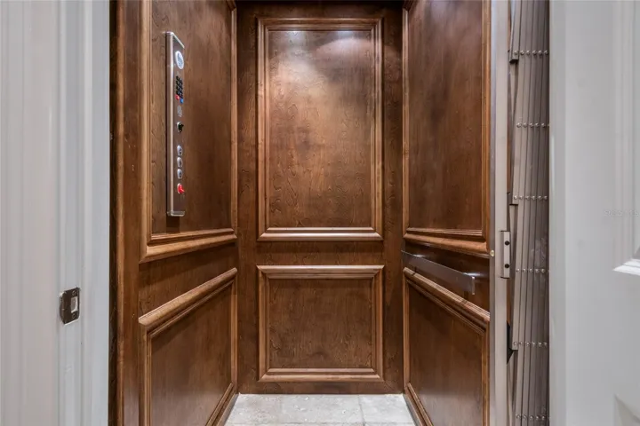 Such quality wood throughout home! Even in the elevator!